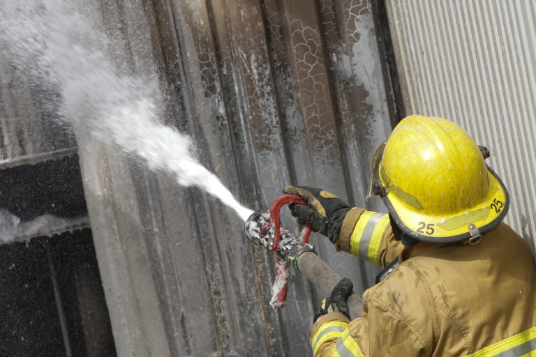 Fireman uses PFAS-containing firefighting foam.