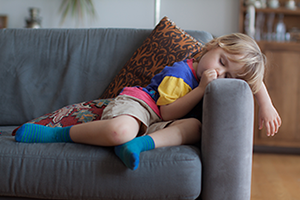 child asleep on the couch