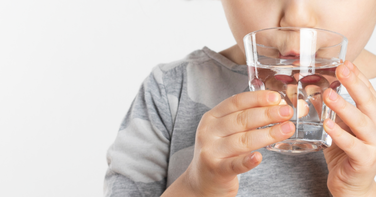 kid drinking glass of water